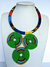Load image into Gallery viewer, This colorful African necklace will make a difference in your outfit. It is approximately 53 cm long. 