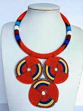 Load image into Gallery viewer, This colorful African necklace will make a difference in your outfit. It is approximately 53 cm long. 