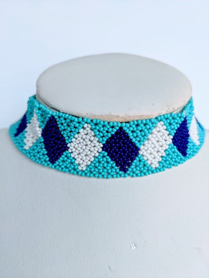 This Necklace is handmade and will be a perfect addition to your outfit. Crafted with glass bead with adjustable ball and loop closure. The choker is about 40 cm long.