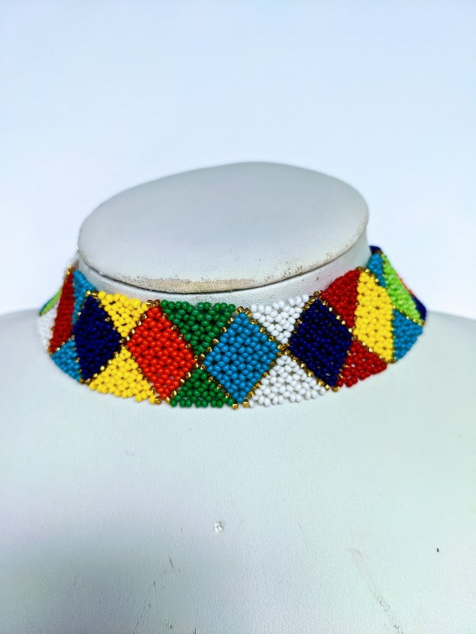 This Necklace is handmade and will be a perfect addition to your outfit. Crafted with glass bead with adjustable ball and loop closure. The choker is about 40 cm long.