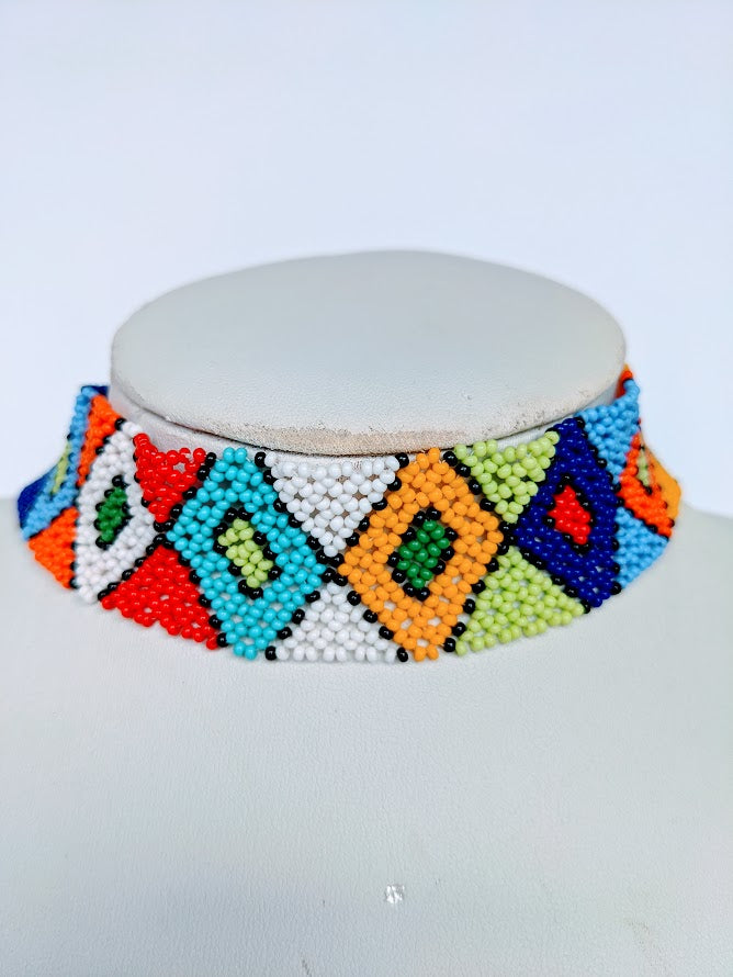 This Necklace is handmade and will be a perfect addition to your outfit. Crafted with glass bead with adjustable ball and loop closure. The choker is about 40 cm long.