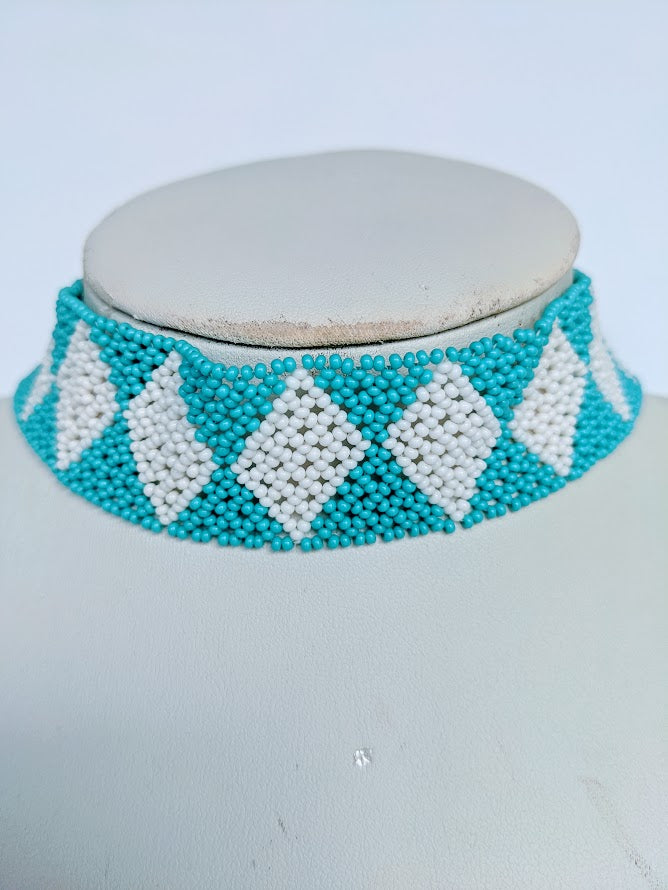 This Necklace is handmade and will be a perfect addition to your outfit. Crafted with glass bead with adjustable ball and loop closure. The choker is about 40 cm long.