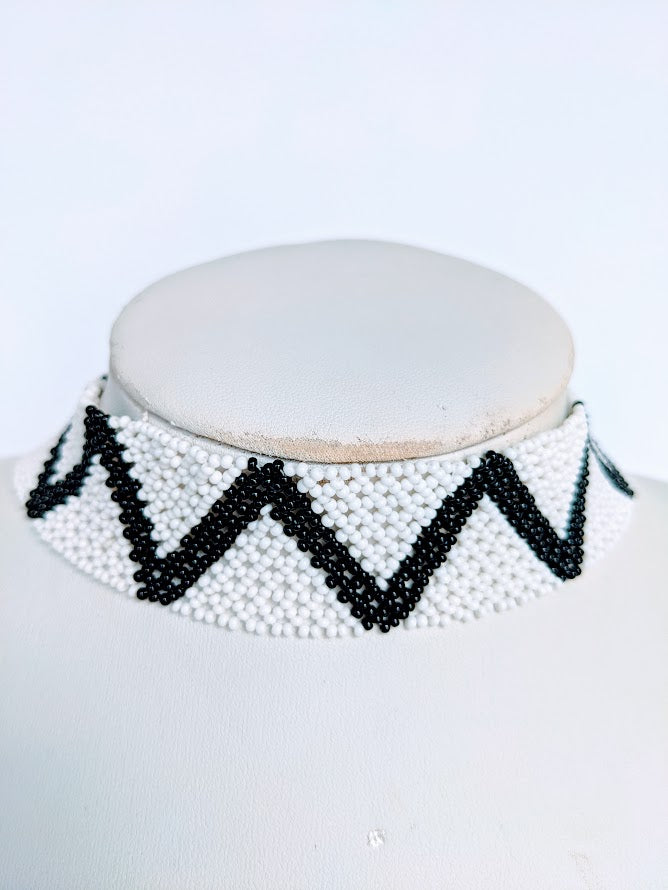 This Necklace is handmade and will be a perfect addition to your outfit. Crafted with glass bead with adjustable ball and loop closure. The choker is about 40 cm long.