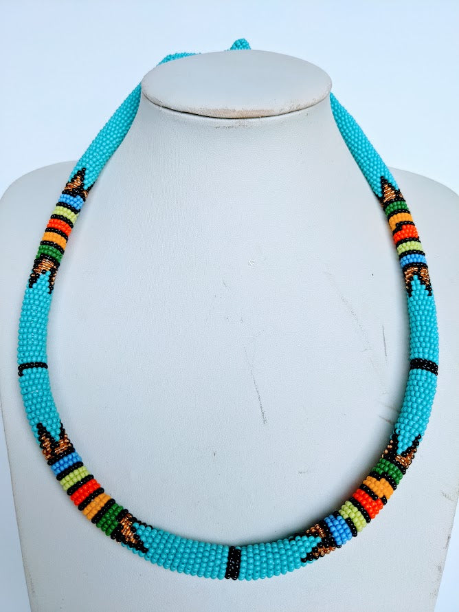 Two in one this necklace can be use as necklace or headband.  It is handmade out of glass bead with adjustable loop at the back. The necklace is about 59 cm long.
