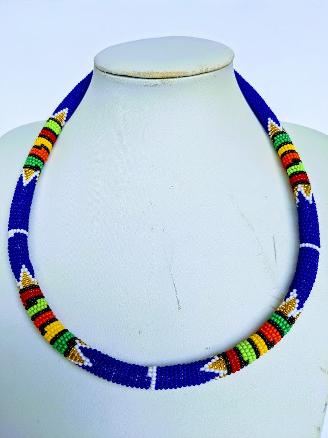 Two in one this necklace can be use as necklace or headband.  It is handmade out of glass bead with adjustable loop at the back. The necklace is about 59 cm long.