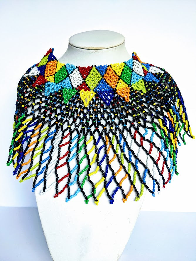 This Necklace is handmade out of glass bead with adjustable loop at the back. The necklace is about 59 cm long.