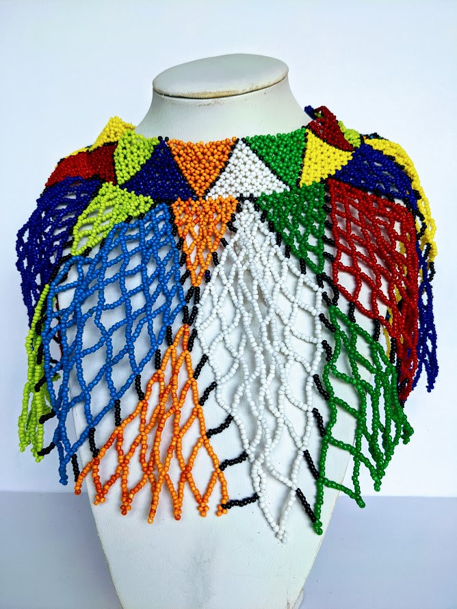 This Necklace is handmade out of glass bead with adjustable loop at the back. The necklace is about 59 cm long.