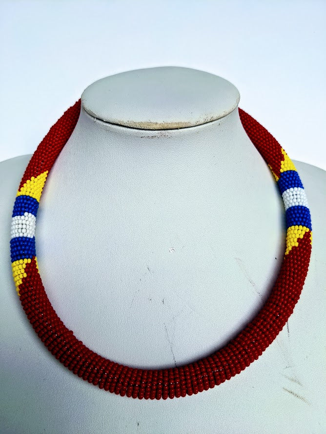 Two in one this necklace can be use as necklace or headband.  It is handmade out of glass bead with adjustable loop at the back.