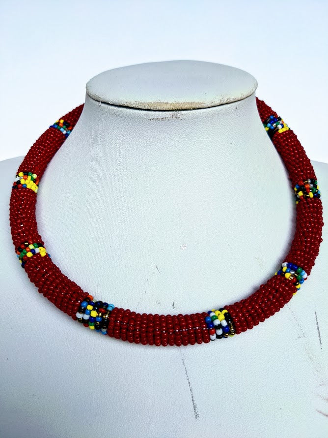 Two in one this necklace can be use as necklace or headband.  It is handmade out of glass bead with adjustable loop at the back.