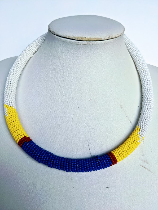 Two in one this necklace can be use as necklace or headband.  It is handmade out of glass bead with adjustable loop at the back.