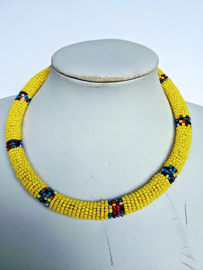 Two in one this necklace can be use as necklace or headband.  It is handmade out of glass bead with adjustable loop at the back.