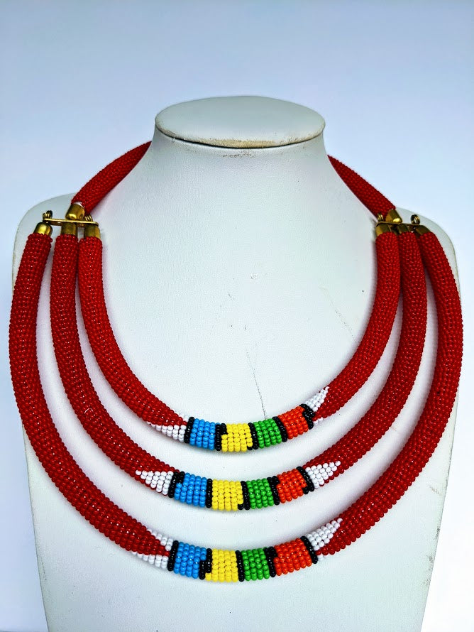Three beautiful necklaces in one. Hand crafted using glass beads. Approximately 40 cm long