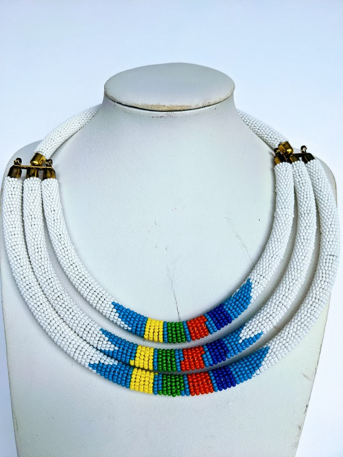 Three beautiful necklaces in one. Hand crafted using glass beads. Approximately 40 cm long