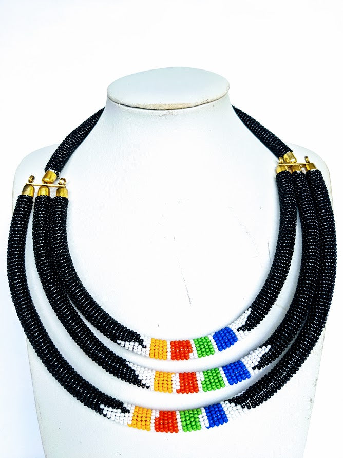 Three beautiful necklaces in one. Hand crafted using glass beads. Approximately 40 cm long