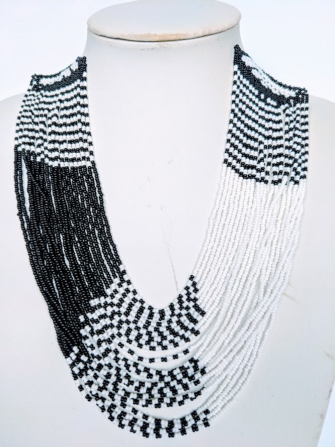 This Necklace is handmade and will be a perfect addition to your outfit. Crafted with glass bead with adjustable ball and loop closure. Handcrafted using glass beads. Approximately 56 cm long.