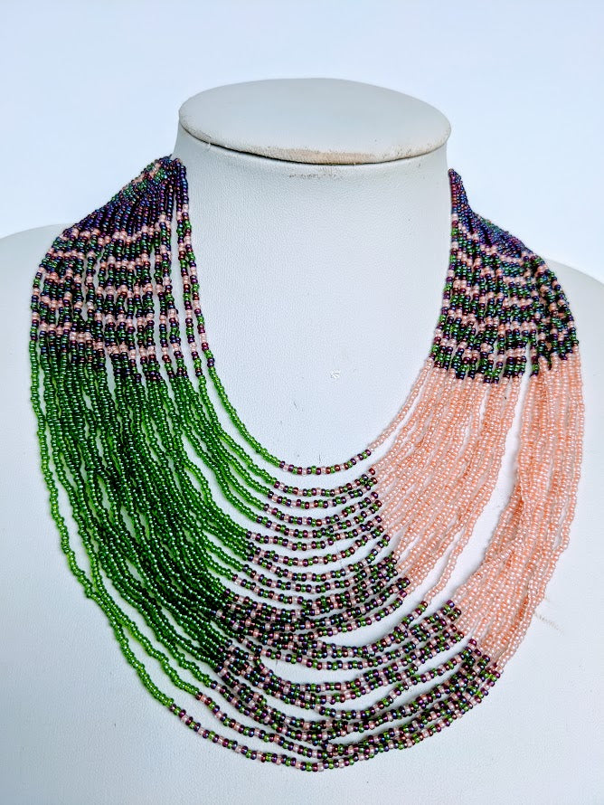 This Necklace is handmade and will be a perfect addition to your outfit. Crafted with glass bead with adjustable ball and loop closure. Handcrafted using glass beads. Approximately 56 cm long.