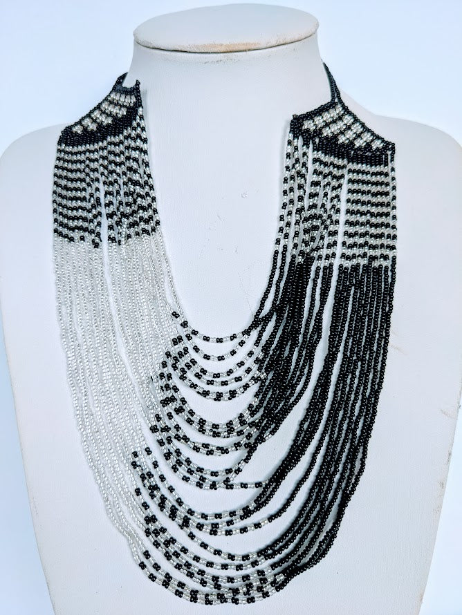 This Necklace is handmade and will be a perfect addition to your outfit. Crafted with glass bead with adjustable ball and loop closure. Handcrafted using glass beads. Approximately 56 cm long.