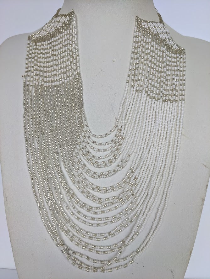 This Necklace is handmade and will be a perfect addition to your outfit. Crafted with glass bead with adjustable ball and loop closure. Handcrafted using glass beads. Approximately 56 cm long.