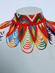 This colorful African necklace will make a difference in your outfit. It is approximately 53 cm long. 