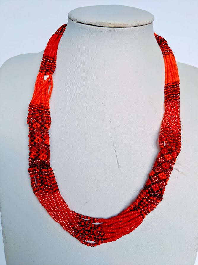 This Necklace is handmade and will be a perfect addition to your outfit. Crafted with glass bead with adjustable ball and loop closure. 