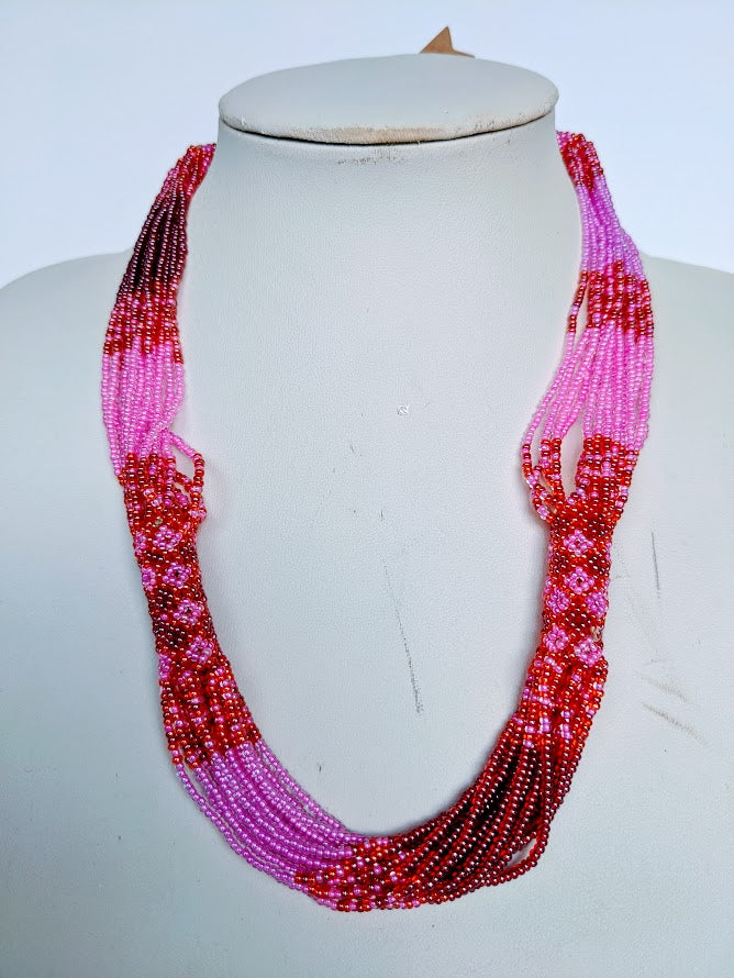 This Necklace is handmade and will be a perfect addition to your outfit. Crafted with glass bead with adjustable ball and loop closure. 