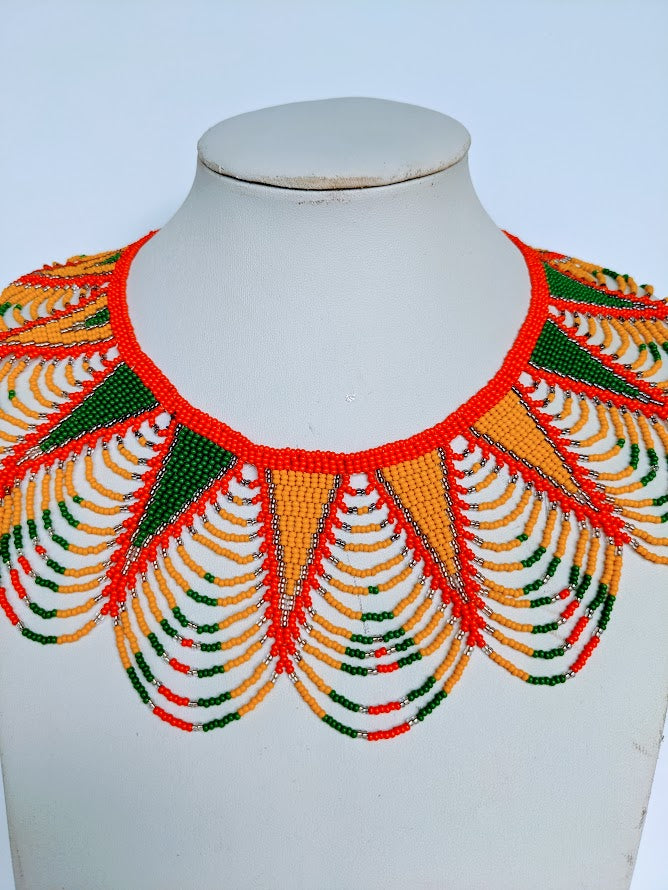 This necklace is handmade out of glass bead with an adjustable loop at the back. The necklace is about 59 cm long. 